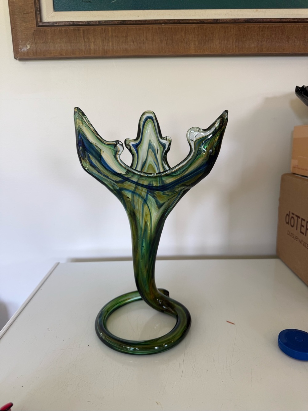 vintage hand-blown art glass vase coiled base and a swirled green, blue yellow